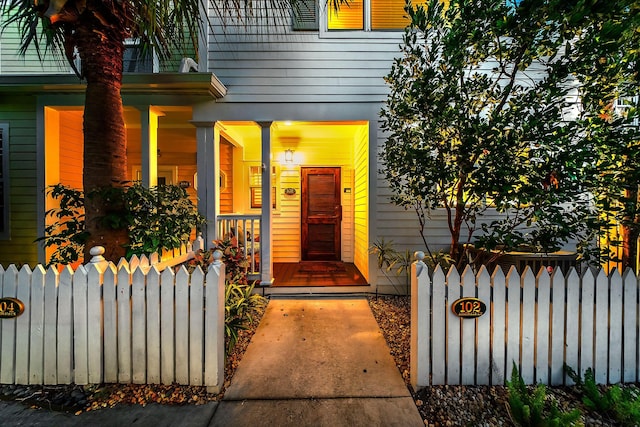 property entrance with radiator heating unit and a porch