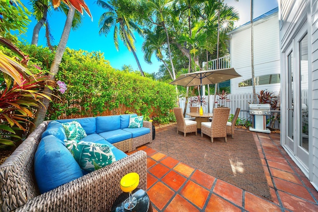 view of patio with outdoor lounge area and grilling area