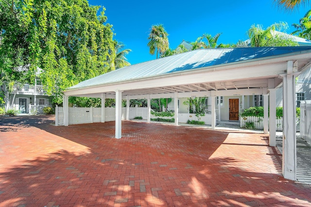 exterior space with a carport