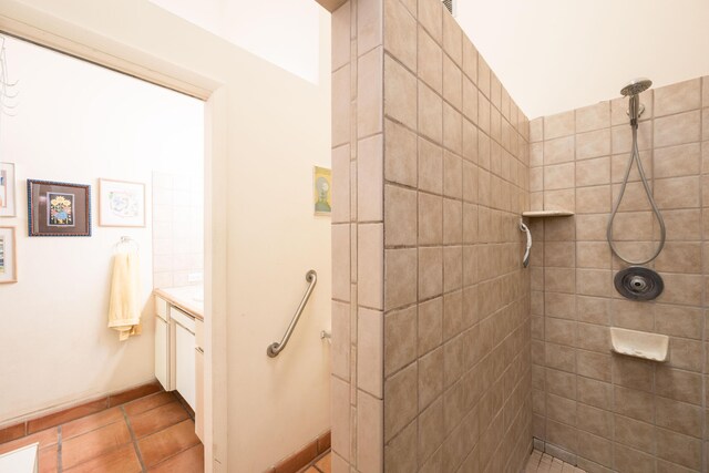 bathroom featuring vanity and a tile shower