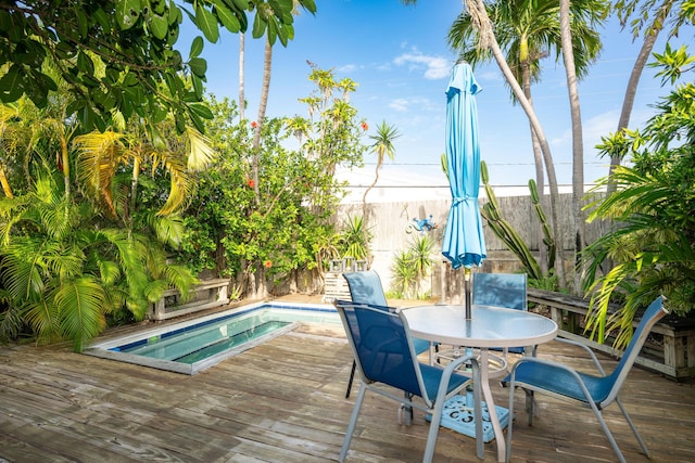 deck with a fenced in pool