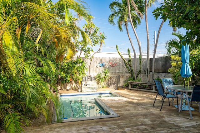 view of swimming pool with a wooden deck