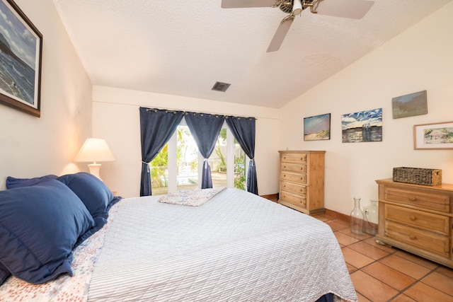 bedroom with lofted ceiling, tile patterned flooring, access to exterior, ceiling fan, and a textured ceiling