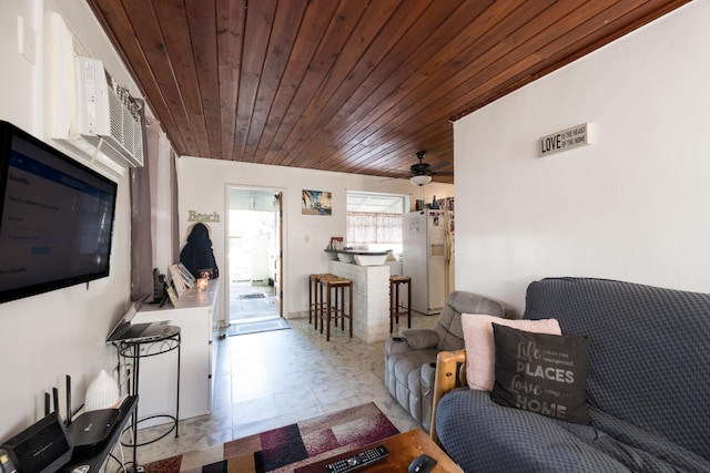 living room with wood ceiling and ceiling fan