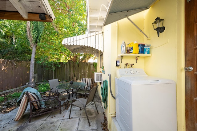 exterior space with laundry area and washer / clothes dryer