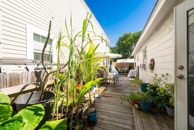 deck featuring fence and outdoor dining space