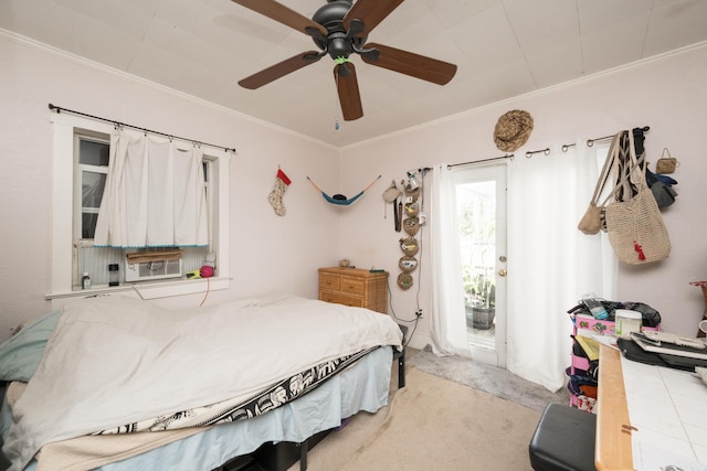 bedroom featuring ornamental molding, cooling unit, a ceiling fan, and light colored carpet