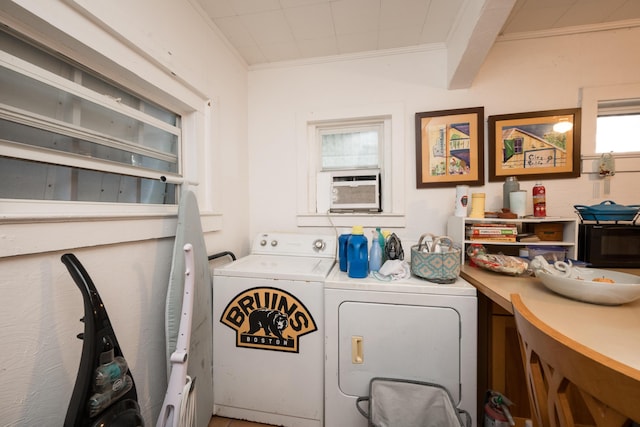 washroom with ornamental molding, cooling unit, laundry area, and washing machine and clothes dryer