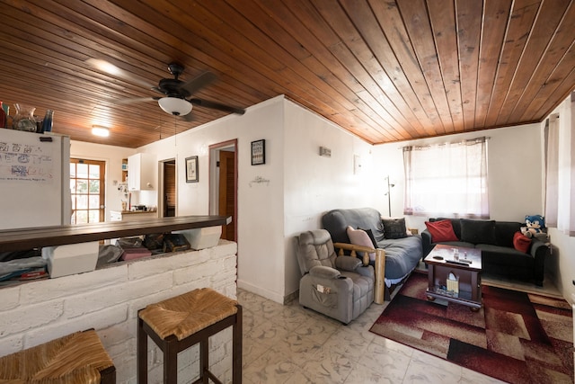 living area featuring wood ceiling and a ceiling fan