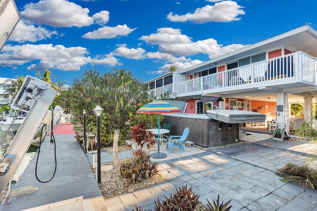 view of patio with a hot tub