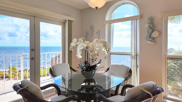 dining area featuring a water view