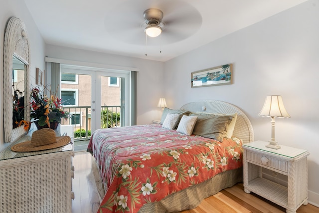 bedroom featuring light hardwood / wood-style flooring, ceiling fan, french doors, and access to exterior