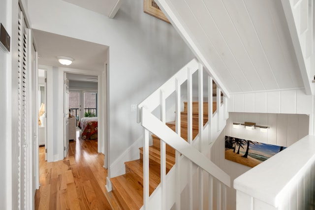 stairs featuring hardwood / wood-style flooring