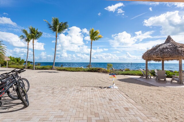 exterior space with a water view and a gazebo