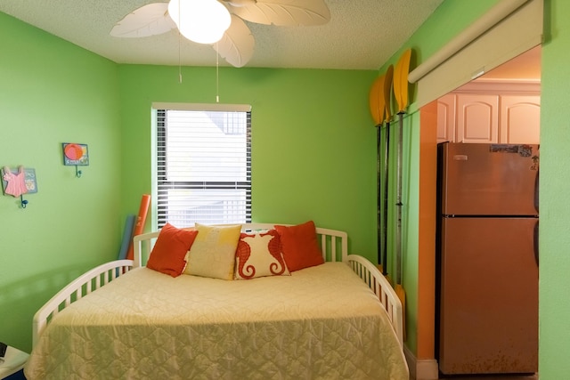 104350 Overseas Hwy Unit A204, Key Largo, FL 33037 - bedroom with freestanding refrigerator, a ceiling fan, and a textured ceiling