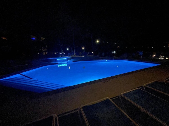 104350 Overseas Hwy Unit A204, Key Largo, FL 33037 - pool at twilight with an outdoor pool