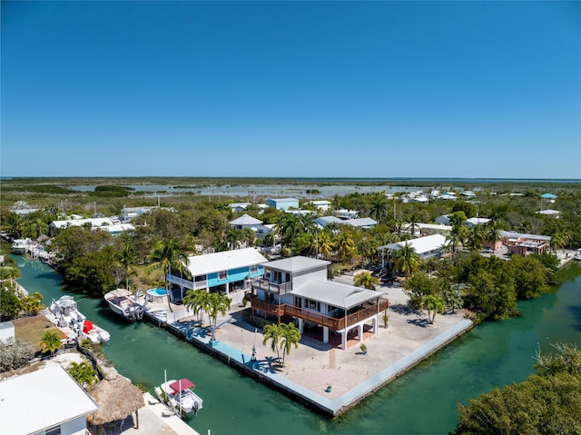 drone / aerial view featuring a residential view and a water view