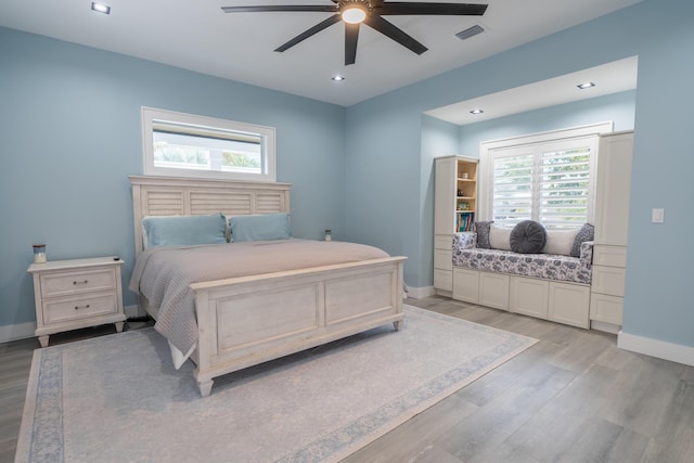 bedroom with recessed lighting, visible vents, light wood-style flooring, ceiling fan, and baseboards