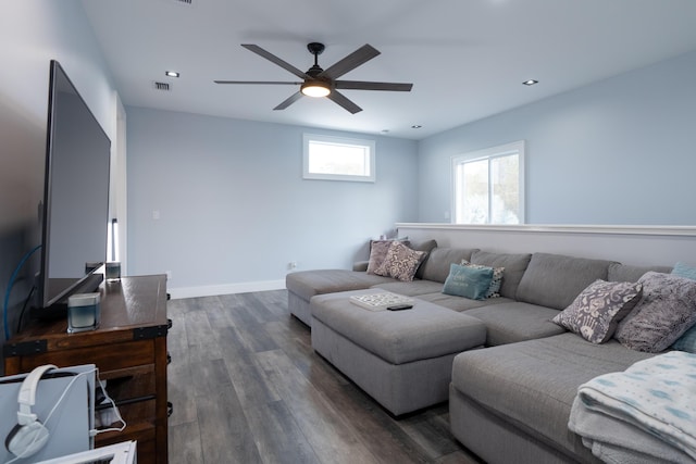 living area featuring baseboards, dark wood finished floors, a ceiling fan, and recessed lighting