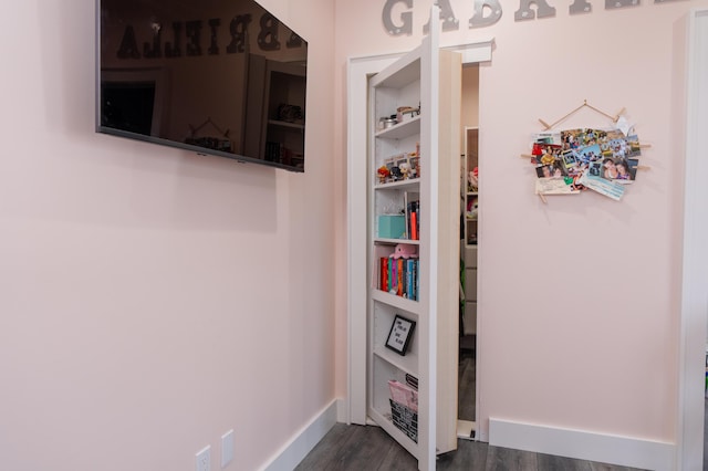 room details with baseboards and wood finished floors