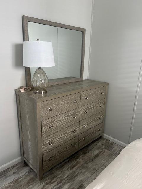 5413 3rd Ave, Stock Island, FL 33040 - bedroom featuring dark wood-style flooring, baseboards, and a closet