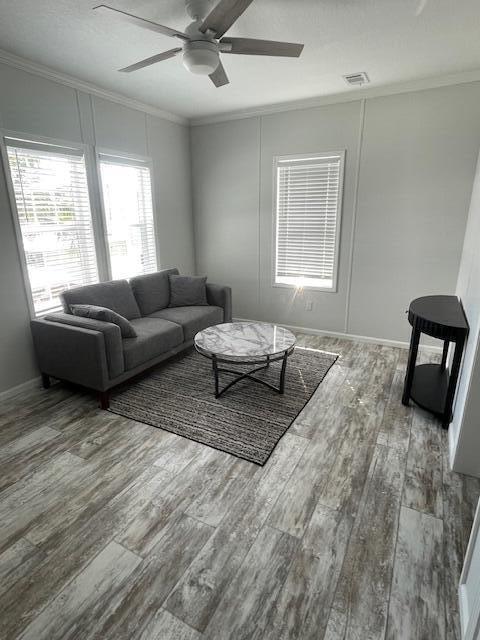 5413 3rd Ave, Stock Island, FL 33040 - living room featuring ornamental molding, a ceiling fan, and wood finished floors