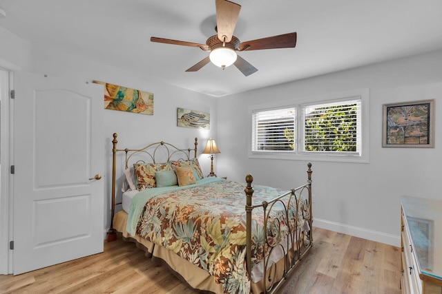 bedroom featuring light hardwood / wood-style floors and ceiling fan