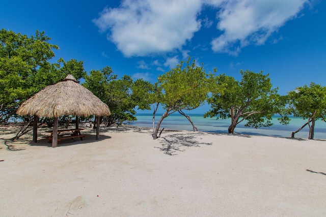 exterior space with a gazebo and a beach view