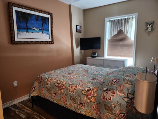 bedroom with wood-type flooring