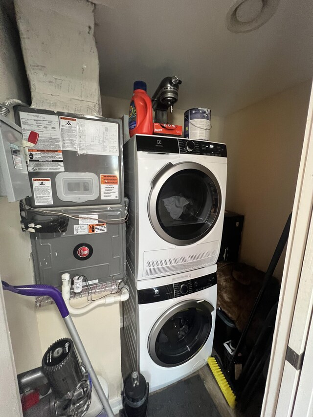 washroom with stacked washer / drying machine