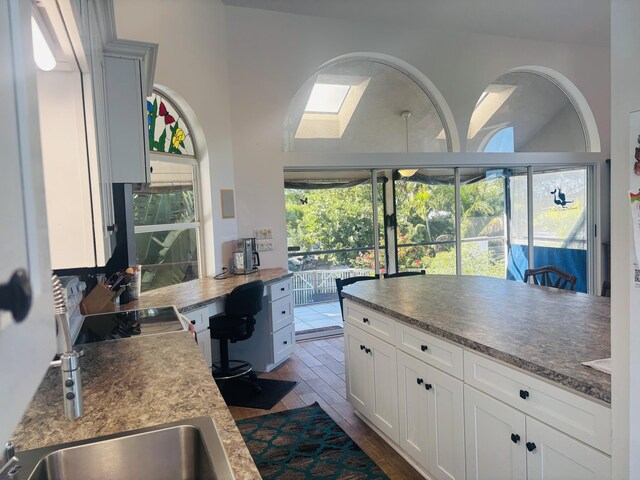 kitchen with white cabinetry and stove