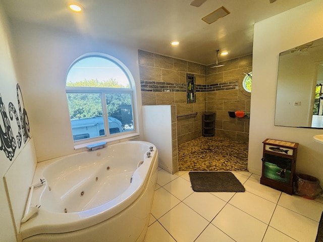 bathroom featuring tile patterned floors and separate shower and tub