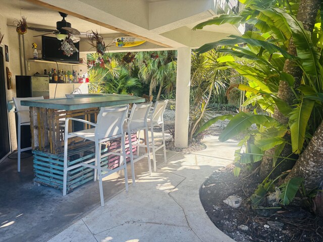 view of patio featuring exterior bar