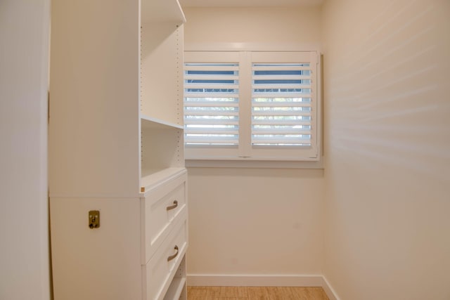 walk in closet featuring light hardwood / wood-style floors