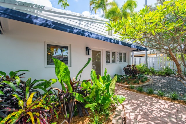 entrance to property with a patio area