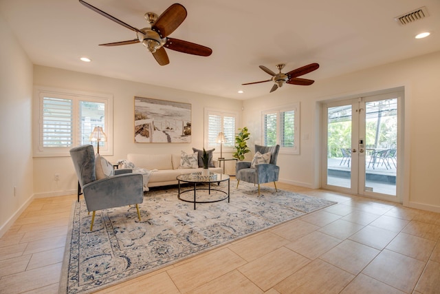 living room with french doors and ceiling fan