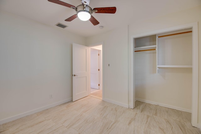 unfurnished bedroom featuring ceiling fan and a closet