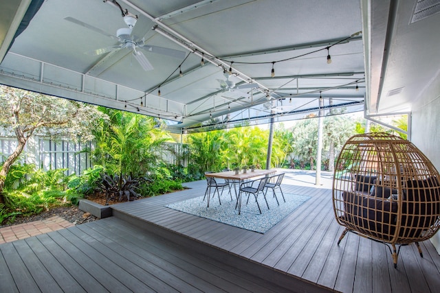 wooden terrace featuring ceiling fan