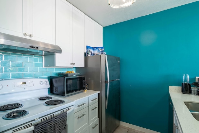 kitchen with stainless steel appliances, under cabinet range hood, white cabinetry, backsplash, and light tile patterned flooring