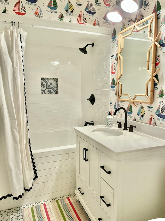 bathroom featuring vanity and shower / bath combination with curtain