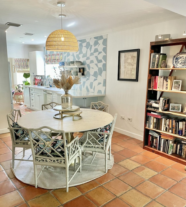 tiled dining room with ornamental molding