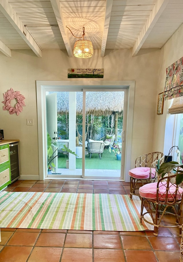 doorway with beamed ceiling and beverage cooler