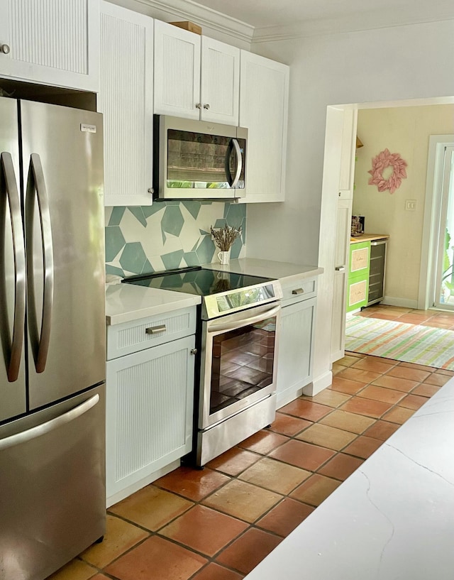 kitchen featuring light tile patterned floors, white cabinetry, backsplash, stainless steel appliances, and wine cooler