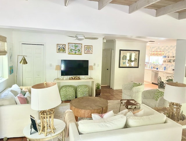 tiled living room featuring ceiling fan and beamed ceiling