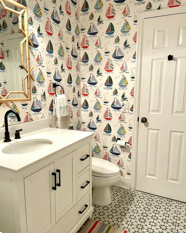 bathroom with vanity and toilet