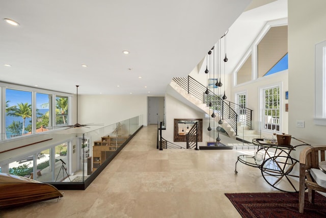 hallway featuring a high ceiling