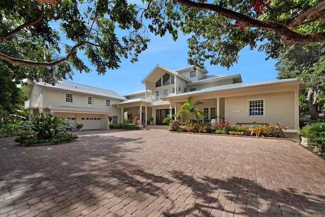 view of front facade with a garage and covered porch