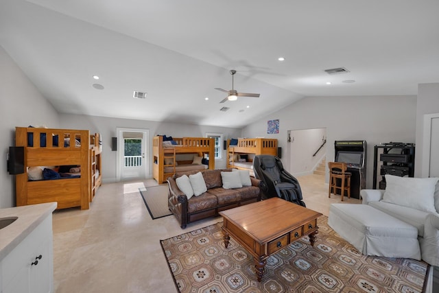 living room featuring lofted ceiling and ceiling fan