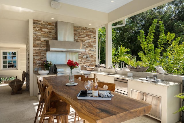 view of patio / terrace featuring area for grilling, sink, and a grill