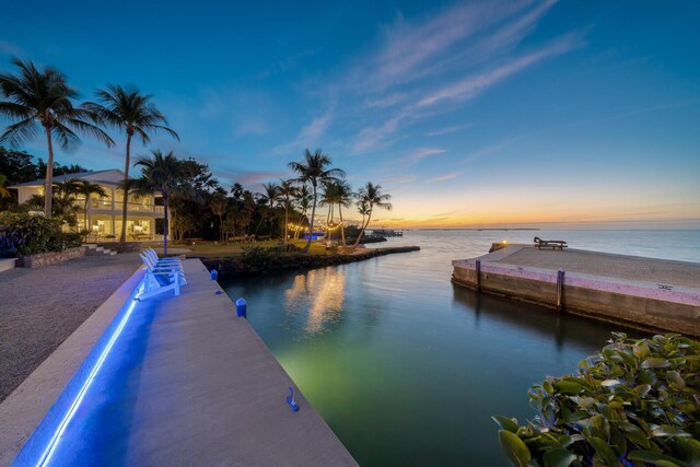 pool at dusk with a water view